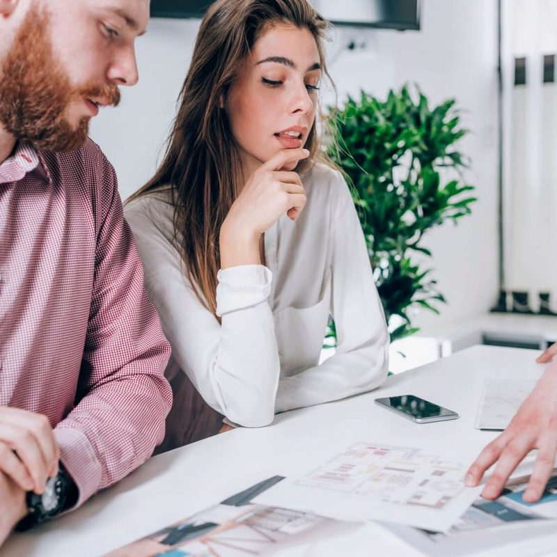 couple-in-real-estate-agency-talking-to-real-estate-agent-1.jpg